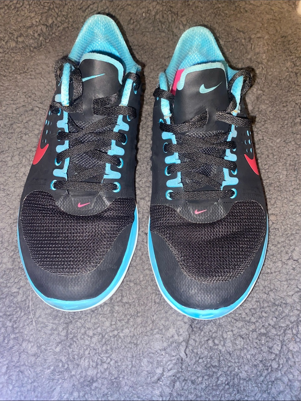 Nike Women’s Black Sneakers with Blue Trim and Pink Swoosh